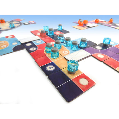 Ink blue bottle pieces arranged on colorful tiles during gameplay